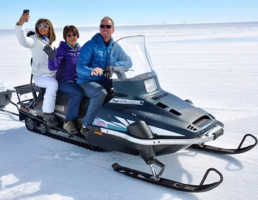 Catching a ride from the Basler to the warming hut at FD 83.