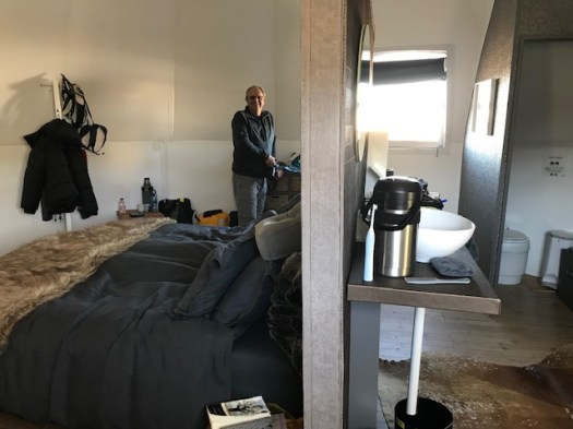 Inside our pod, divided by a partition into bed and bath.