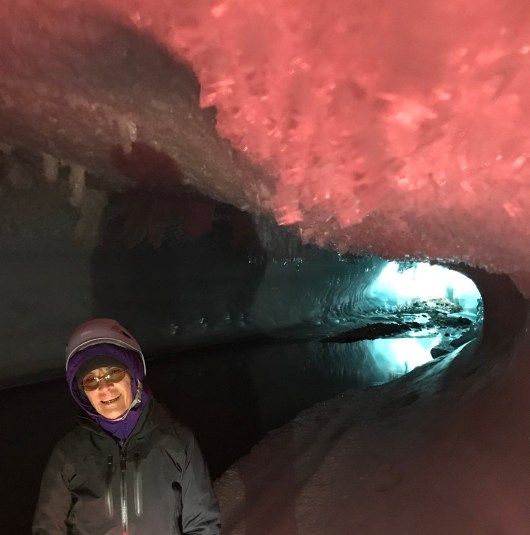 The back of the cave under red light. The exit is not passable with so much water..