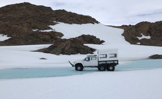 Crossing the river on the wy to the hike. Mat tested the river bottom before taking us along.