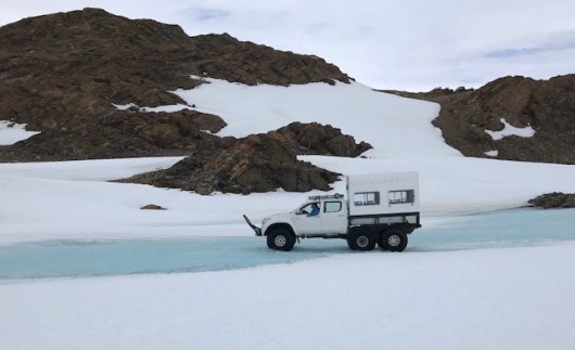 Crossing the river on the wy to the hike. Mat tested the river bottom before taking us along.