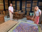 Mark looking at inlaid tile tables and samples of wood&nbsp;detail.