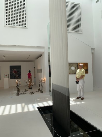 The second is a canvas soaking up motor oil from a basin and the effect it has on the fabric. I did not get the name of the artist, sorry to say.