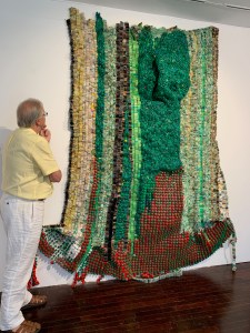 Found objects like used toothbrushes and discarded soap dispenser caps make this an interesting commentary on how people use and waste things.