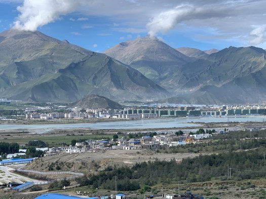 Beginning the climb out of the Lhasa Valley. Many Chinese high rises under construction, as everywhere around the city.