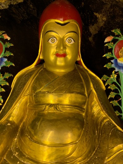 Brass sculpture of a Red Hat Buddha